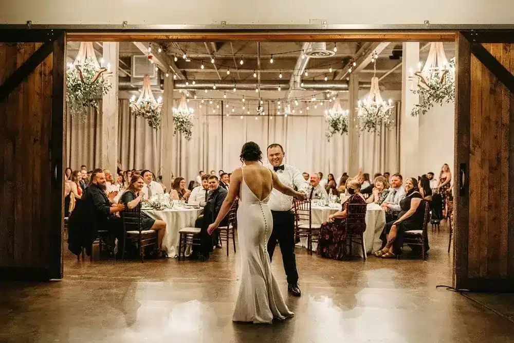 Hideaway Cellars barn doors and chandeliers during an evening reception, SoDo Seattle