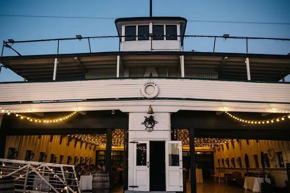 The MV Skansonia, a historic 1929 ferry, lit at dusk on Lake Union