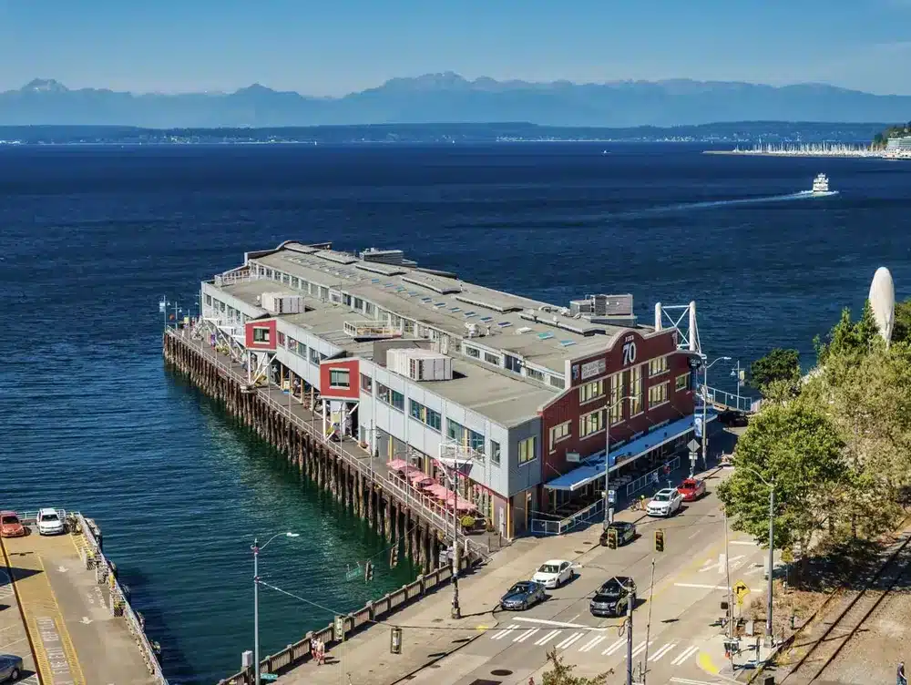 The Point at Pier 70 on the Seattle waterfront with the Olympic Mountains behind