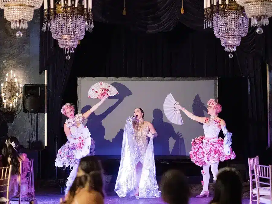 Performers on stage at a birthday party at The Ruins